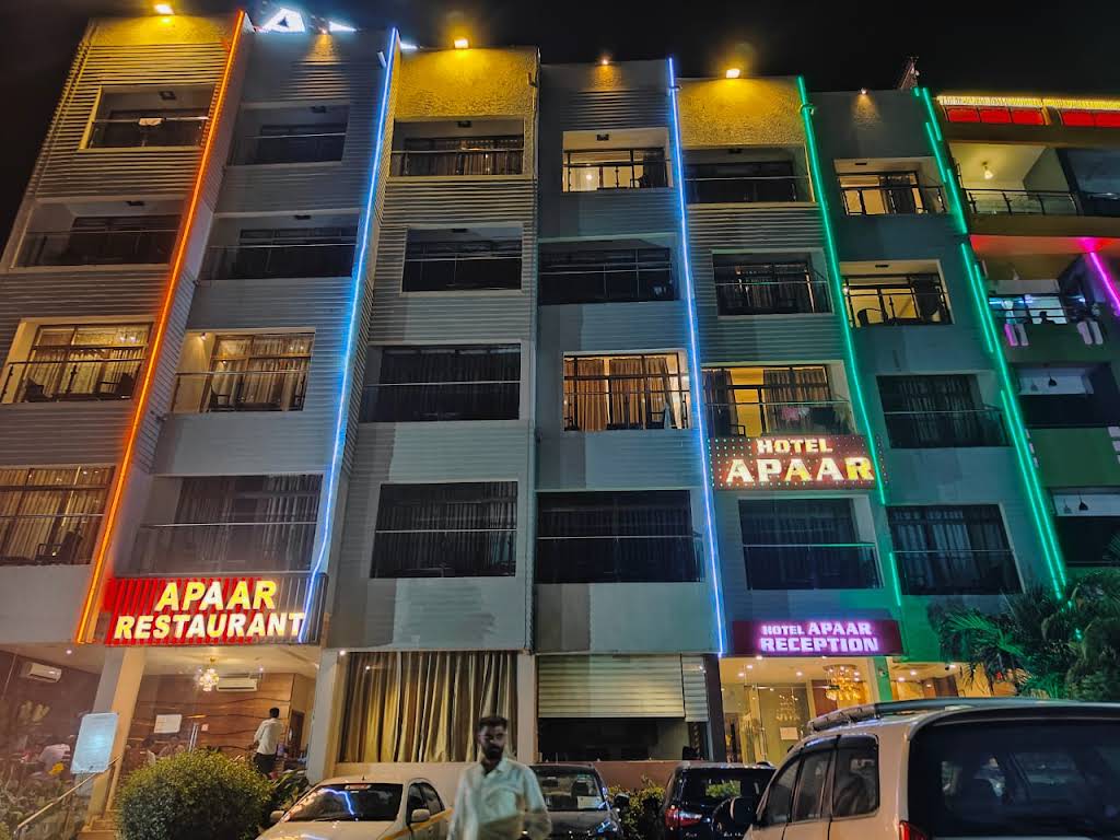 Hotel Apaar, Diu lit up at night, with Apaar Restaurant and reception signage